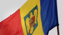 The flag of Romania with the silhouette of a cannon. Close-Up