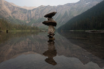 stacked rocks in a lake 