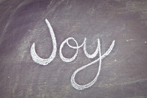 Joy written on a chalkboard