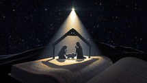 Open Bible and nativity scene under starlight 