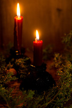 candle sticks with christmas greenery