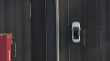 aerial view over passing traffic on a freeway 