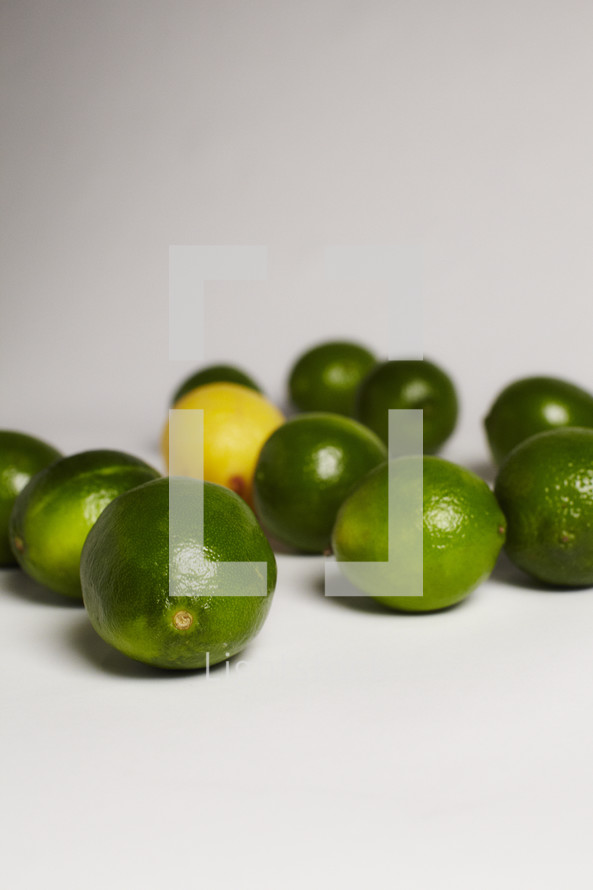 One lemon among a group of limes