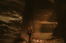 woman standing in a cave