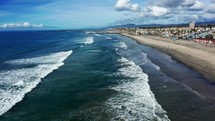Drone flying over Oceanside, California beach.