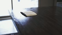 A Bible on a table opened to Psalms 