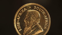 A Krugerrand gold bullion coin rotating