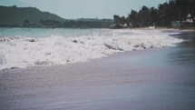 tide washing onto an island beach 