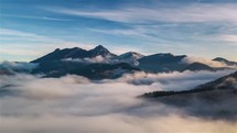 Aerial hyperlapse of beautiful foggy alps mountains landscape panorama
