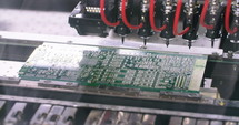 Surface mount Technology machine places resistors, capacitors, transistors, LED and integrated circuits.