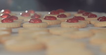 Close up of cookies with strawberry jam.