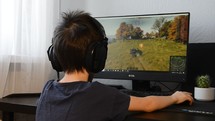 Russia - Febraury 09, 2020: Teenager playing World of tanks game on PC. World of tanks is an online multiplayer video game 