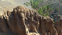 Aerial of rock formations inside a volcanic crater