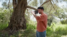 Young Man Shoots With Vintage Super 35 Camera In The Calabrian Countryside