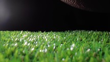 The ball on the field of a football stadium