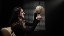  Model posing with a globe map 