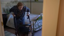 an elderly woman using a walker 