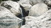water trickling over a rock 