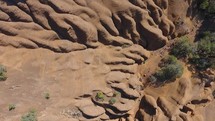 Aerial of strange rock formations inside an inactive volcanic crater