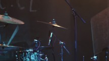 man playing drums at a concert 
