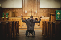 Man praying inside church