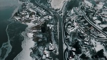 aerial view over a winter shoreline and highway 