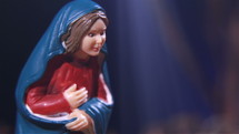 Nativity scenes exhibit figures representing Virgin Mary.