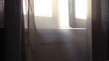 Warm Sunbeams Streaming Through Residential Window

