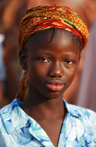 African girl in local traditional headdress {Try search for Ethnic Faces}