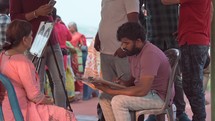 Indian man drawing pictures of worshipers at the Kailasagiri Temple in Vizag Visakhapatnam, India.