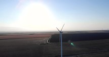 Aerial View Of Sustainable Resource Wind turbine On A Sunny Day.