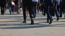pedestrians on a city sidewalk - editorial use only