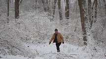 Man walking in snowy woods
