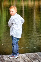 boy fishing on a dock