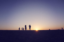 silhouette of a large family at sunset 