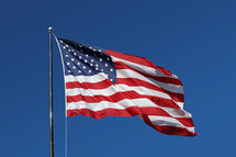 American Flag flying on a flag pole 