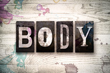 word body on wood background 
