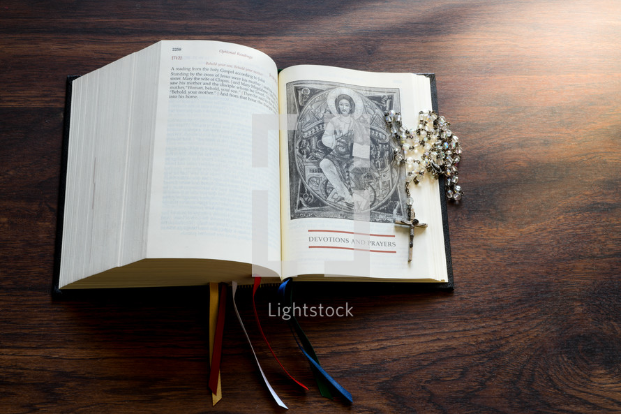 rosary on a faith book 