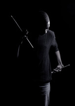 a man holding drum sticks 
