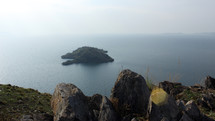 view of a small island from the top of a cliff 