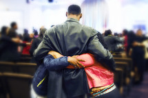 hugs of friendship in a church 