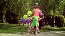 clown giving out balloons 