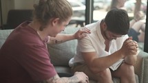 men's group Bible study, men discussing scripture and praying 