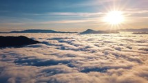 Slow motion sunrise above clouds landscape in beautiful nature summer colors
