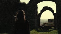 Girl walking in an ancient fortress