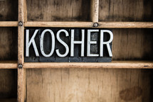 word kosher in blocks on a bookshelf 