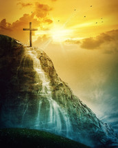 cross at the top of a waterfall and sun 