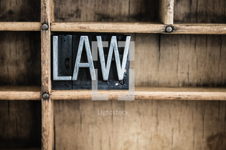 word law in blocks on a bookshelf 