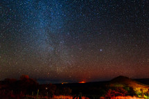 stras in the night sky above the mountains 