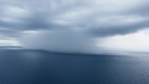 Cloudburst over the ocean near the coast